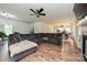 Inviting living room with hardwood floors, fireplace, and a large sectional couch for relaxation at 3020 Quiet Ln, Iron Station, NC 28080