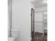 Clean, white bathroom with marble countertops, toilet, and shower with walk-in closet at 3103 Suggs St, Belmont, NC 28012