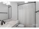This bathroom has a single vanity with marble counters, toilet and shower at 3103 Suggs St, Belmont, NC 28012