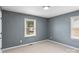 Bedroom with carpeted floor, gray walls, and window providing natural light at 3103 Suggs St, Belmont, NC 28012