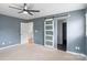 Spacious bedroom with ceiling fan, carpeted floor and glass sliding door to bathroom at 3103 Suggs St, Belmont, NC 28012