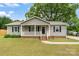 Charming single-story home featuring a welcoming front porch and well-maintained landscaping in a suburban setting at 3103 Suggs St, Belmont, NC 28012