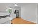 Updated kitchen with white cabinets, stainless steel appliances, and hardwood floors at 3103 Suggs St, Belmont, NC 28012