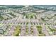 An aerial view of an expansive community showcasing houses, green spaces, a gazebo, a pool, and tennis courts at 3105 Bonterra Blvd, Indian Trail, NC 28079