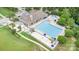 Aerial view of the community pool area with lounge chairs, tables, umbrellas, and a shallow splash area for children at 3105 Bonterra Blvd, Indian Trail, NC 28079