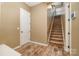 Entryway with wood floors leading to carpeted stairs at 3105 Bonterra Blvd, Indian Trail, NC 28079