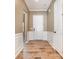 Elegant entryway with hardwood floors, white wainscoting, and neutral paint at 3105 Bonterra Blvd, Indian Trail, NC 28079