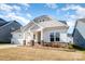 Inviting single-Gathering home boasts a well-kept lawn, stone accents, and a convenient two-car garage at 3105 Bonterra Blvd, Indian Trail, NC 28079