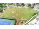 Open green space near a tennis court with walking paths and residential homes in the background at 3105 Bonterra Blvd, Indian Trail, NC 28079