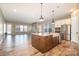 Lovely kitchen view highlighting a center island with a sink and stainless steel appliances at 3105 Bonterra Blvd, Indian Trail, NC 28079