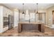 Well-equipped kitchen features a large center island, stainless appliances, and plenty of cabinets at 3105 Bonterra Blvd, Indian Trail, NC 28079