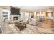 Cozy living room with a stone fireplace, comfortable seating, and an open view to the kitchen at 3105 Bonterra Blvd, Indian Trail, NC 28079