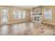 Bright, open living room featuring a stone fireplace and large windows at 3105 Bonterra Blvd, Indian Trail, NC 28079