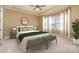 Comfortable bedroom features a tray ceiling, a ceiling fan, and decorative furniture at 3105 Bonterra Blvd, Indian Trail, NC 28079