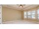 Spacious bedroom with a tray ceiling and large windows providing natural light at 3105 Bonterra Blvd, Indian Trail, NC 28079