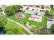 Aerial view of the neighborhood playground and play area featuring swings, a slide, and seating surrounded by lawn at 3105 Bonterra Blvd, Indian Trail, NC 28079