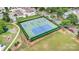 Aerial view of the community tennis and pickleball courts, with green and blue surfaces and surrounding trees at 3105 Bonterra Blvd, Indian Trail, NC 28079