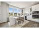 Dining area with modern table and chairs, large windows, and a view of the property at 3114 Stelfox St, Charlotte, NC 28262
