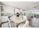 Open-concept kitchen and dining area with modern appliances, an island, and lots of natural light at 3114 Stelfox St, Charlotte, NC 28262