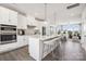 Modern kitchen with stainless steel appliances, an island with seating, and an open floor plan at 3114 Stelfox St, Charlotte, NC 28262