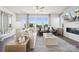 Bright living room features large windows, comfortable seating, and a stylish fireplace, creating a welcoming atmosphere at 3114 Stelfox St, Charlotte, NC 28262