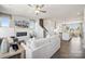 Open-concept living area with fireplace, seamlessly connecting to a modern kitchen and dining space at 3114 Stelfox St, Charlotte, NC 28262
