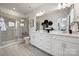 Elegant bathroom with double vanity, modern fixtures, and tiled walk-in shower at 3118 Stelfox St, Charlotte, NC 28262