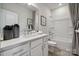 Bright bathroom featuring a single vanity, tile floors and combination shower and bathtub at 3118 Stelfox St, Charlotte, NC 28262