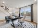 Home office with large windows providing natural light, desk, and an executive chair at 3118 Stelfox St, Charlotte, NC 28262