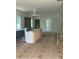Kitchen in progress features an island, cabinetry, and natural light at 312 Wesley Heights Way # A, Charlotte, NC 28208