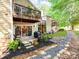 Multi-level deck overlooking a landscaped yard with a rock pathway, creating a serene outdoor retreat at 3308 Selwyn Farms Ln # 2, Charlotte, NC 28209