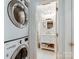Stylish bathroom adjacent to laundry featuring a modern vanity, elegant mirror, and ample storage at 3308 Selwyn Farms Ln # 2, Charlotte, NC 28209