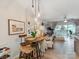 Cozy dining area with pendant lighting and hardwood floors, open to the living room at 3308 Selwyn Farms Ln # 2, Charlotte, NC 28209