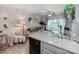 Bright open-concept living room featuring modern décor, light-colored wood floors, and seamless transition to the outdoors at 3308 Selwyn Farms Ln # 2, Charlotte, NC 28209