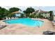 Inviting community pool surrounded by lounge chairs, perfect for a relaxing day in the sun at 3308 Selwyn Farms Ln # 2, Charlotte, NC 28209