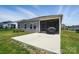 The backyard features a covered porch, a concrete patio, and a grassy lawn at 3833 Isenhour Rd, Kannapolis, NC 28081