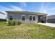 The rear of the house features a screened-in porch and a small patio with grassy area at 3833 Isenhour Rd, Kannapolis, NC 28081