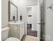 Bathroom with a sink, toilet, and doorway to another room at 3833 Isenhour Rd, Kannapolis, NC 28081