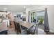Open-concept dining area features a dining table, and flows to the living area and outdoor patio at 3833 Isenhour Rd, Kannapolis, NC 28081