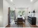 Inviting dining area features a large table, stylish chairs, and natural light from sliding glass doors at 3833 Isenhour Rd, Kannapolis, NC 28081