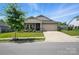 Inviting single-Gathering home with a well-manicured lawn, attached garage, and charming curb appeal at 3833 Isenhour Rd, Kannapolis, NC 28081