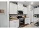 Bright kitchen featuring stainless steel appliances, light gray counters, and tile backsplash at 3833 Isenhour Rd, Kannapolis, NC 28081