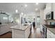 Open-concept kitchen boasts stainless appliances, an island, and seamless flow to the living area at 3833 Isenhour Rd, Kannapolis, NC 28081