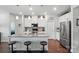 Modern kitchen boasts stainless appliances, gray counters, pendant lighting and wood floors at 3833 Isenhour Rd, Kannapolis, NC 28081