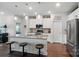 Bright kitchen features stainless appliances, pendant lighting, and a spacious island with bar seating at 3833 Isenhour Rd, Kannapolis, NC 28081