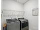 This laundry room includes a Whirlpool washer and dryer as well as overhead storage at 3833 Isenhour Rd, Kannapolis, NC 28081