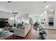 Open-concept living space with hardwood floors and neutral tones, flowing into the dining and kitchen areas at 3833 Isenhour Rd, Kannapolis, NC 28081