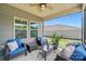 The screened-in porch features comfortable seating and provides plenty of natural light at 3833 Isenhour Rd, Kannapolis, NC 28081