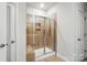 Tiled shower with glass door and bench in a modern bathroom at 3833 Isenhour Rd, Kannapolis, NC 28081