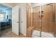 Bathroom featuring tiled shower with glass door and seat at 3833 Isenhour Rd, Kannapolis, NC 28081